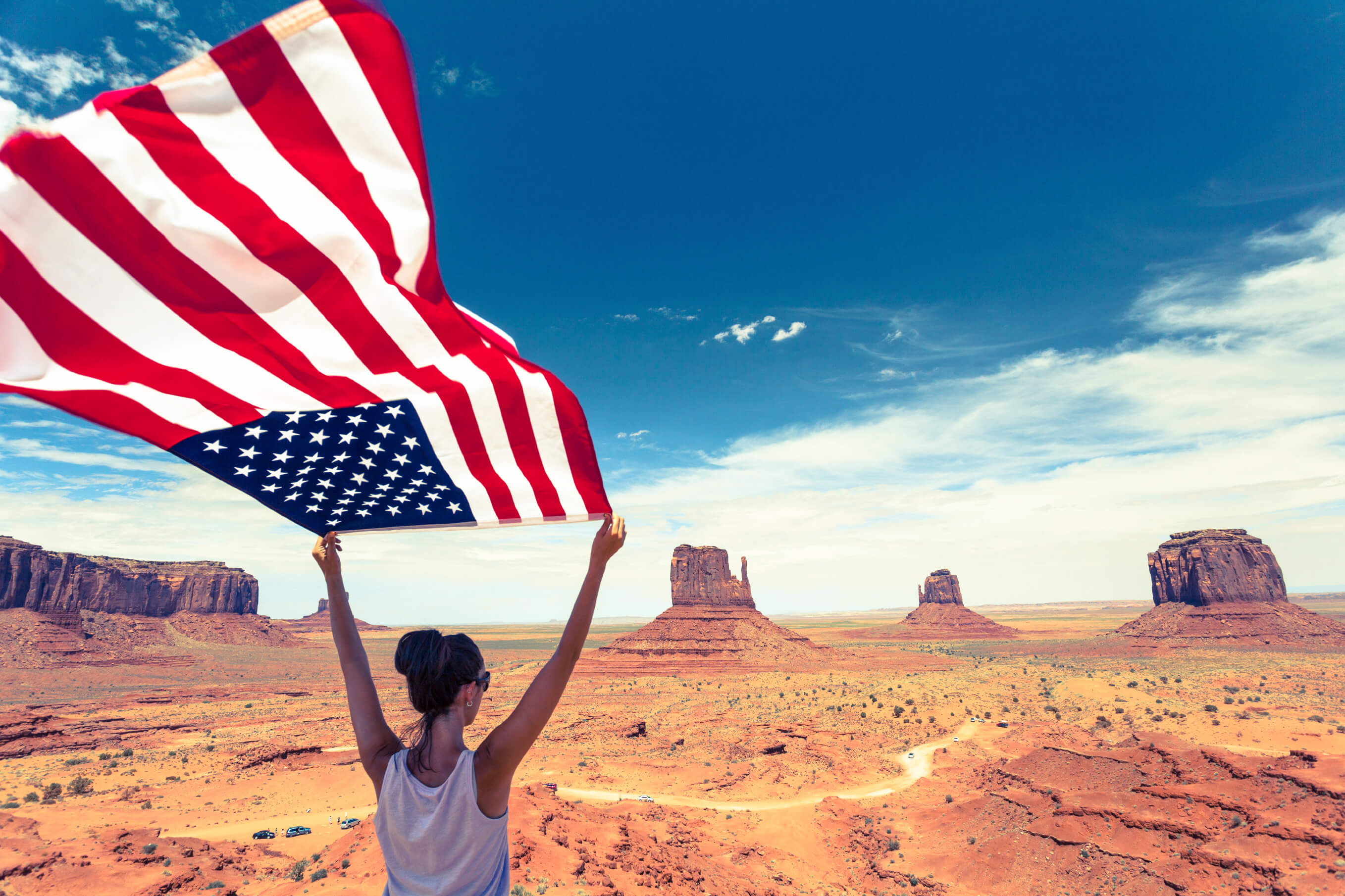 MegaMillions record jackpot Woman in the desert holding an American flag