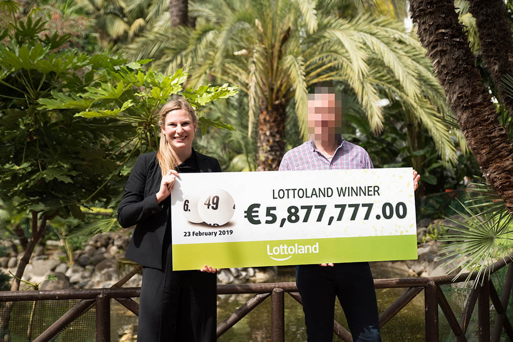 German Lottery Winner Lucky in Love German Lottery Winner holds up giant cheque