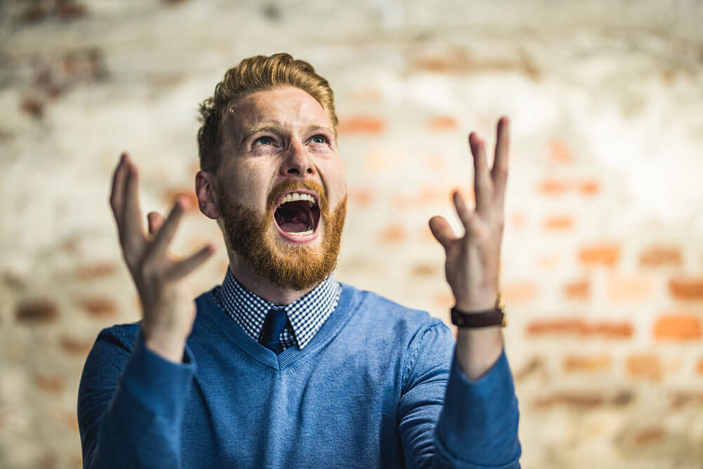 Bearded red-headed man shouts as he realises he did not  claim his lottery jackpot win in time