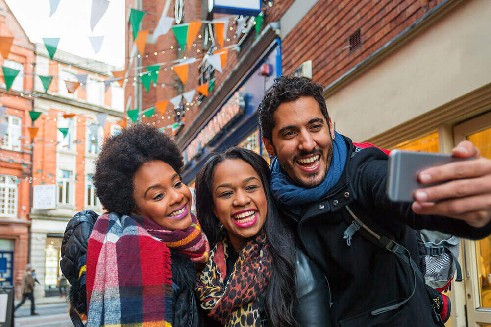 What are the odds of winning the Irish Lotto? Happy friends betting on Irish Lotto