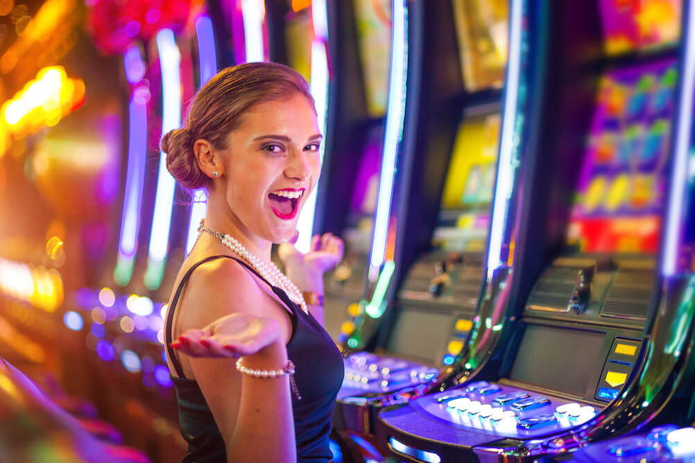 happy-woman-infront-of-casino-slots
