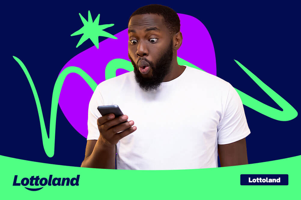Surprised man looking at his phone, learning how to deposit money to his Lottoland account. 