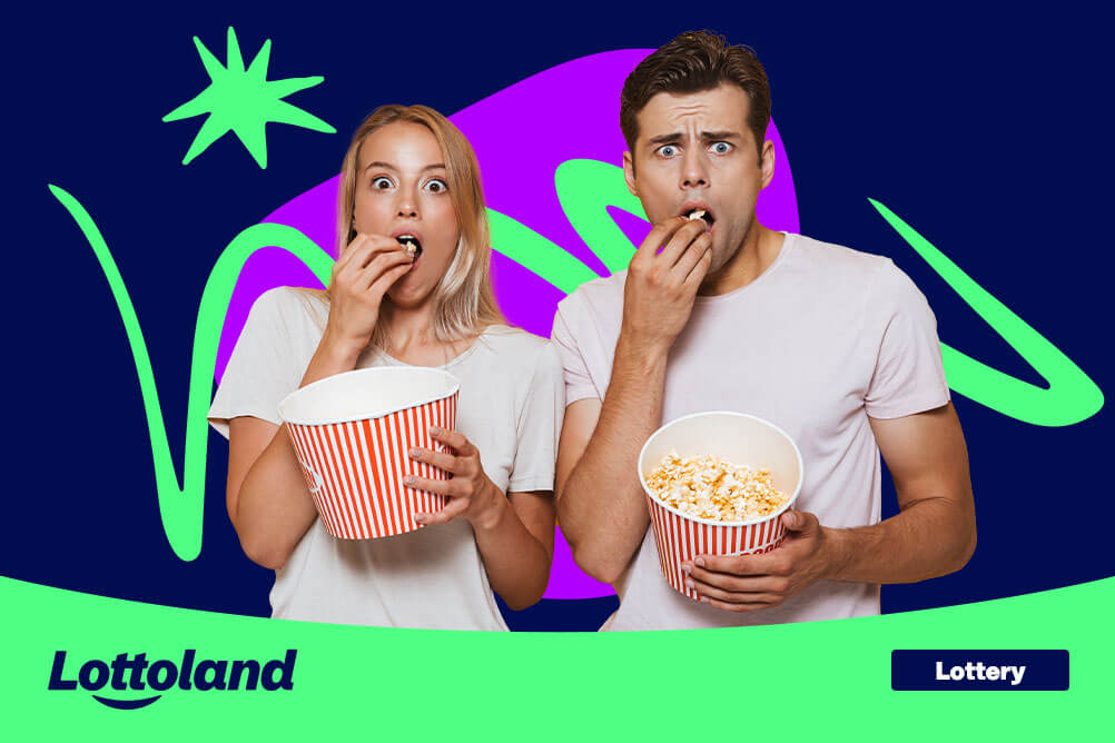 Surprised couple eating popcorn, watching inspirational movies that can change your life. 